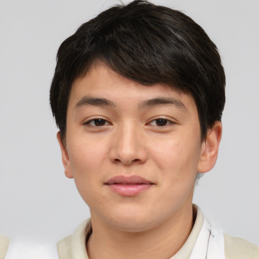 Joyful asian young-adult male with short  brown hair and brown eyes
