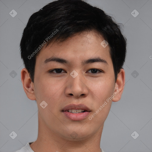 Joyful asian young-adult male with short  brown hair and brown eyes