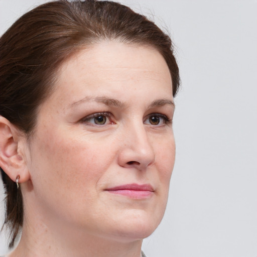 Joyful white adult female with short  brown hair and grey eyes