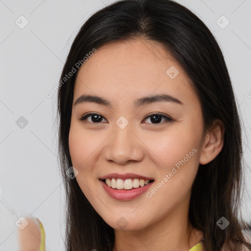 Joyful white young-adult female with long  brown hair and brown eyes