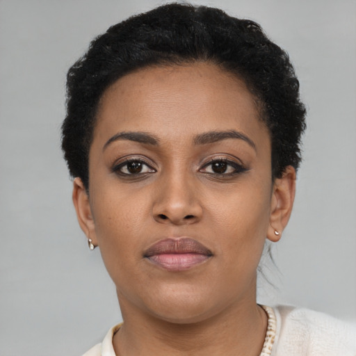 Neutral black young-adult female with short  brown hair and brown eyes