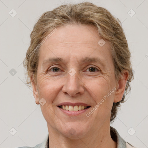 Joyful white middle-aged female with short  brown hair and brown eyes