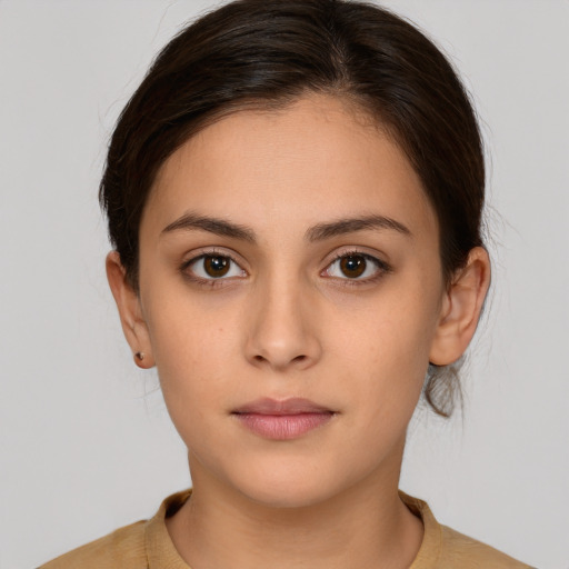 Neutral white young-adult female with medium  brown hair and brown eyes