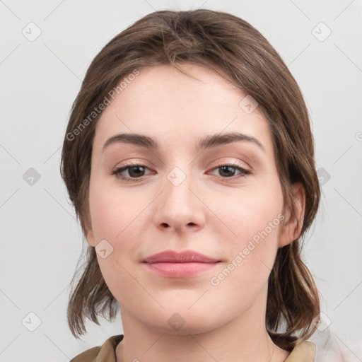 Joyful white young-adult female with medium  brown hair and grey eyes