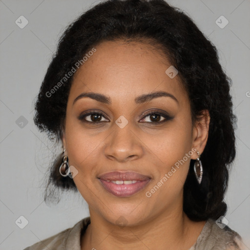 Joyful black young-adult female with long  brown hair and brown eyes