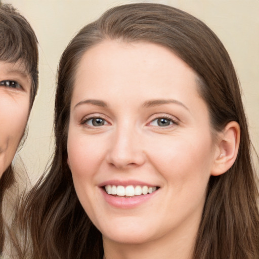 Joyful white young-adult female with long  brown hair and brown eyes