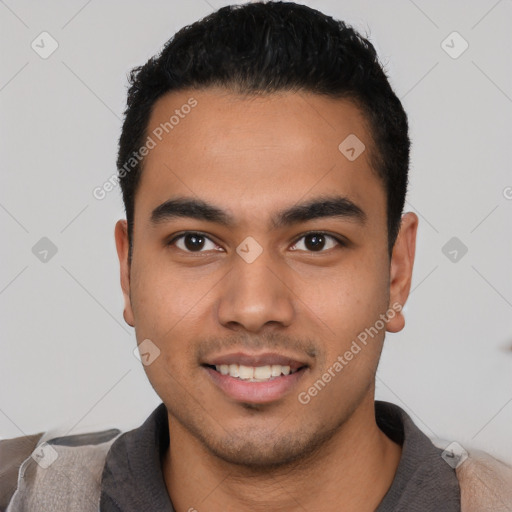 Joyful latino young-adult male with short  black hair and brown eyes