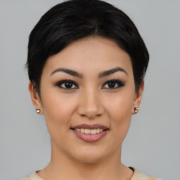 Joyful asian young-adult female with short  black hair and brown eyes