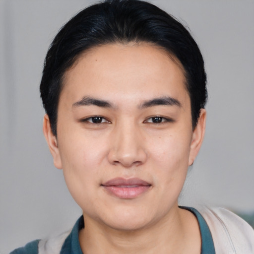 Joyful white young-adult male with short  black hair and brown eyes
