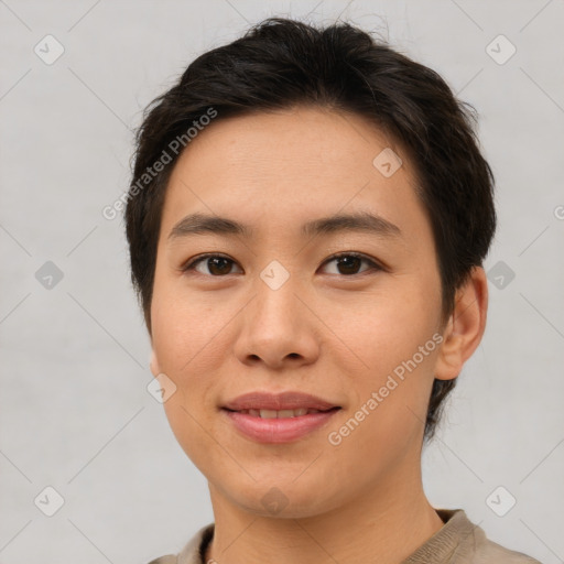 Joyful asian young-adult female with short  brown hair and brown eyes