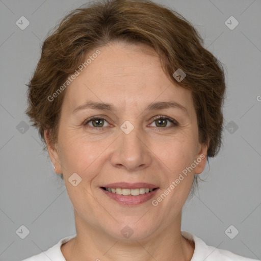 Joyful white adult female with medium  brown hair and brown eyes