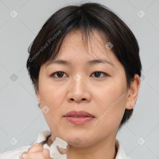 Joyful white adult female with medium  brown hair and brown eyes