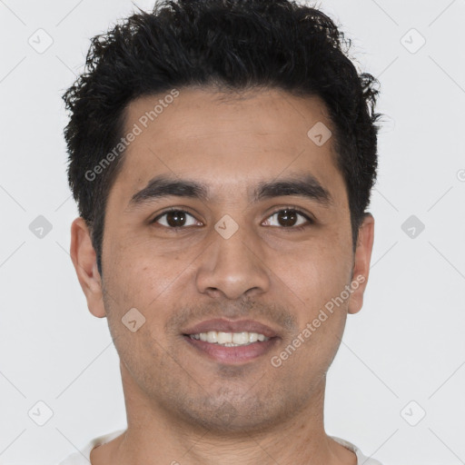 Joyful white young-adult male with short  black hair and brown eyes