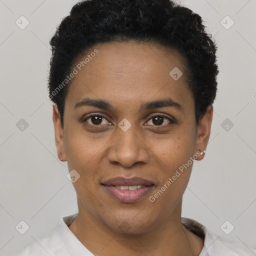 Joyful black young-adult female with short  black hair and brown eyes