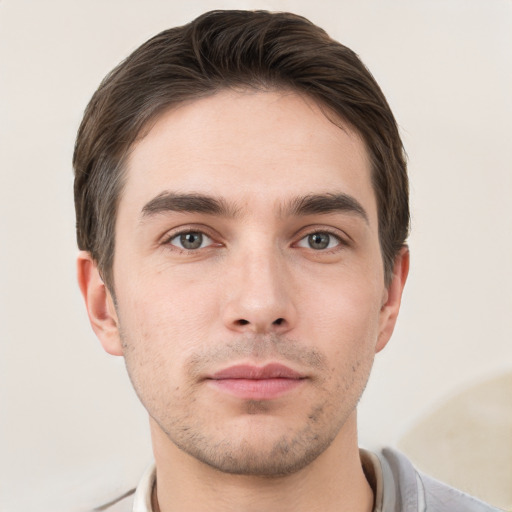 Neutral white young-adult male with short  brown hair and grey eyes