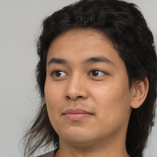 Joyful white young-adult male with medium  brown hair and brown eyes