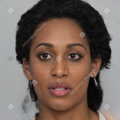 Joyful black young-adult female with medium  black hair and brown eyes