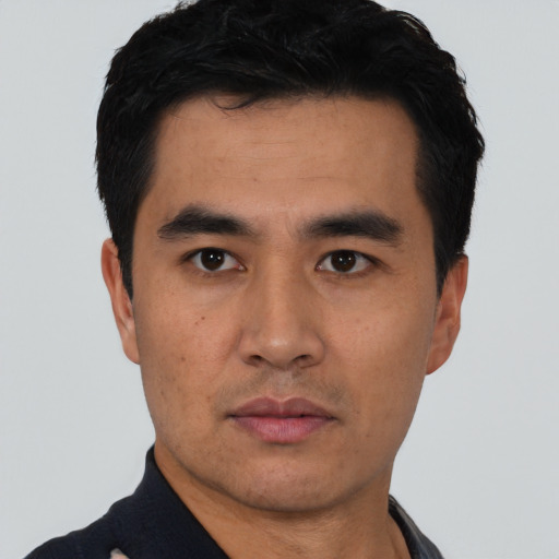 Neutral asian young-adult male with short  black hair and brown eyes
