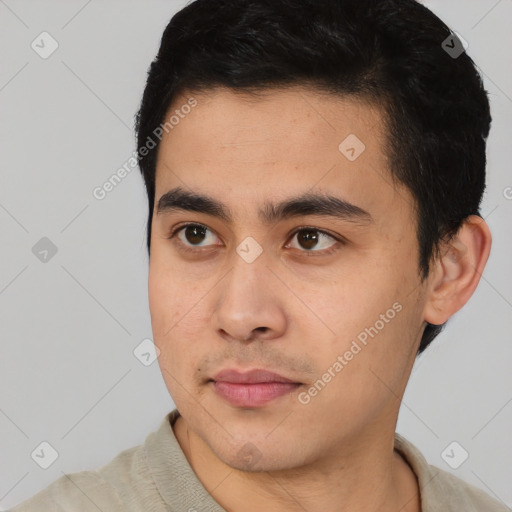 Joyful latino young-adult male with short  black hair and brown eyes