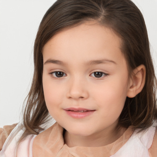 Joyful white child female with medium  brown hair and brown eyes