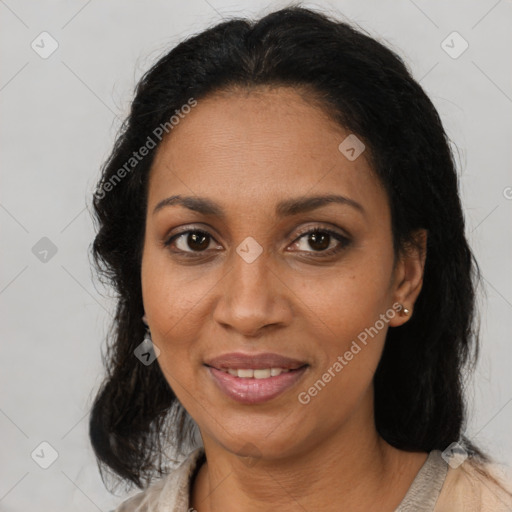 Joyful black adult female with medium  brown hair and brown eyes