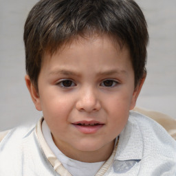 Joyful white child male with short  brown hair and brown eyes