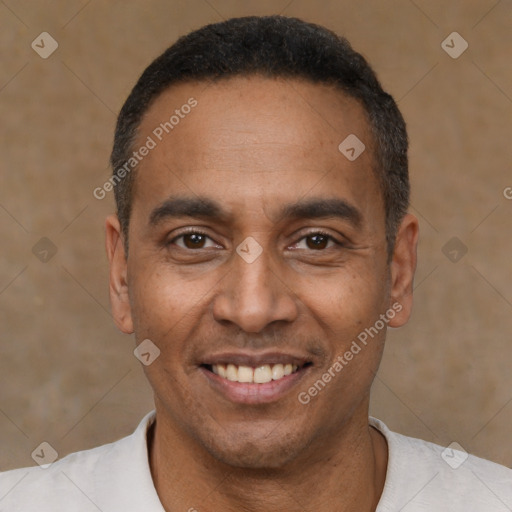 Joyful latino adult male with short  black hair and brown eyes