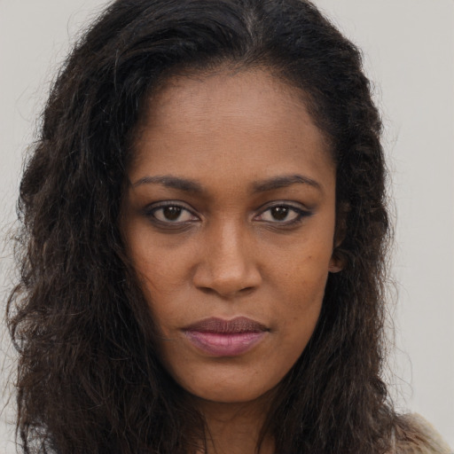 Neutral black young-adult female with long  brown hair and brown eyes