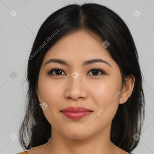 Joyful latino young-adult female with medium  black hair and brown eyes