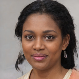 Joyful black young-adult female with medium  brown hair and brown eyes