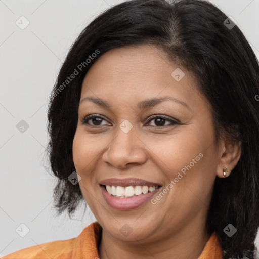 Joyful latino young-adult female with medium  brown hair and brown eyes