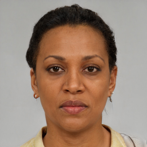 Neutral latino adult female with short  brown hair and brown eyes