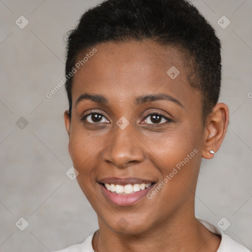 Joyful black young-adult female with short  brown hair and brown eyes