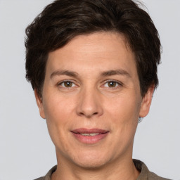 Joyful white adult female with short  brown hair and brown eyes