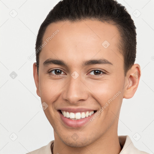 Joyful white young-adult male with short  brown hair and brown eyes