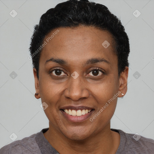 Joyful black young-adult female with short  black hair and brown eyes