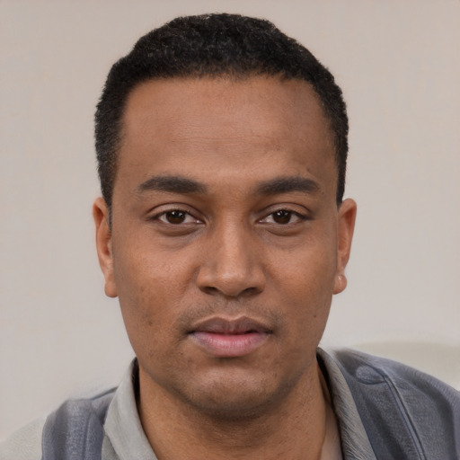 Neutral black young-adult male with short  black hair and brown eyes