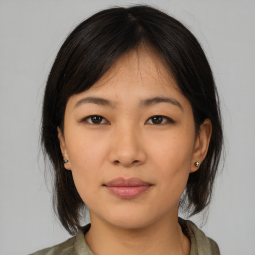 Neutral asian young-adult female with medium  brown hair and brown eyes