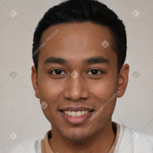 Joyful black young-adult male with short  black hair and brown eyes