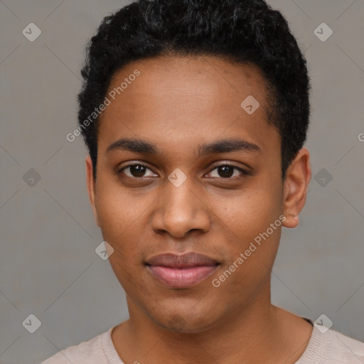 Joyful black young-adult male with short  black hair and brown eyes