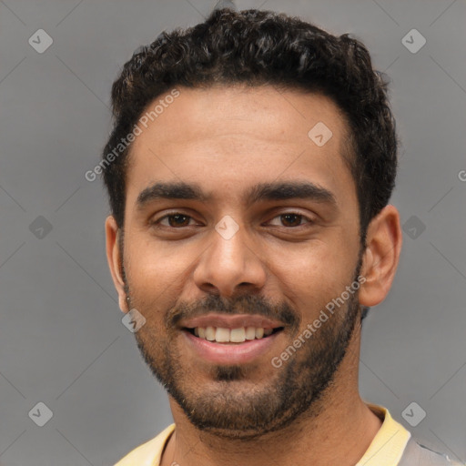 Joyful white young-adult male with short  black hair and brown eyes