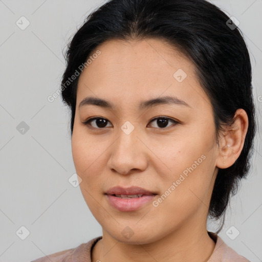 Joyful asian young-adult female with medium  brown hair and brown eyes