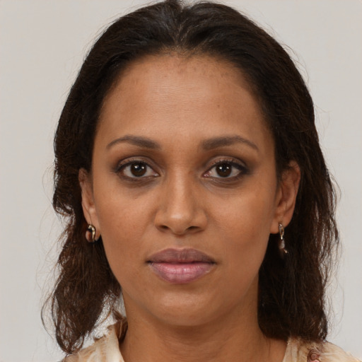 Neutral black adult female with medium  brown hair and brown eyes