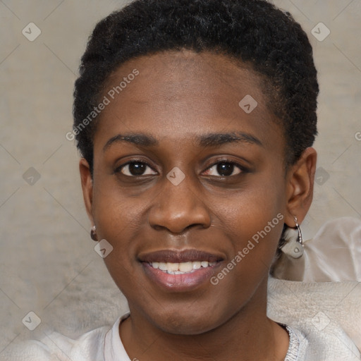 Joyful black young-adult female with short  brown hair and brown eyes