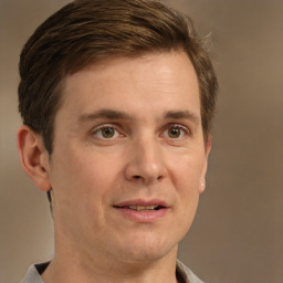 Joyful white adult male with short  brown hair and brown eyes