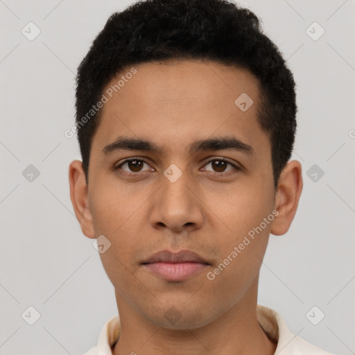 Neutral latino young-adult male with short  black hair and brown eyes