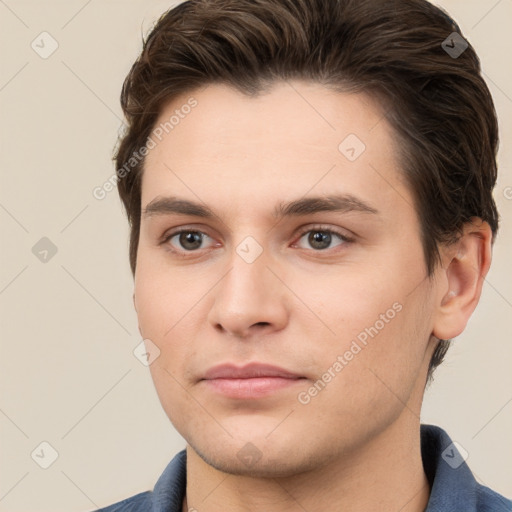 Neutral white young-adult male with short  brown hair and brown eyes