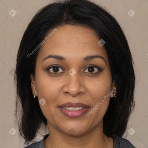 Joyful latino adult female with medium  brown hair and brown eyes