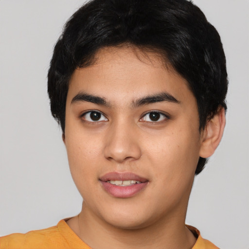 Joyful asian young-adult male with short  black hair and brown eyes