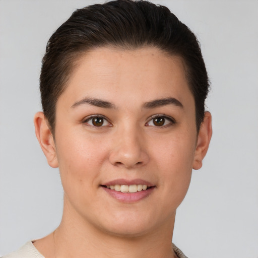 Joyful white young-adult female with short  brown hair and brown eyes